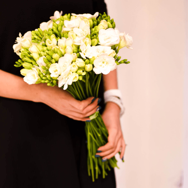 Woman Holding Guernsey freesias
